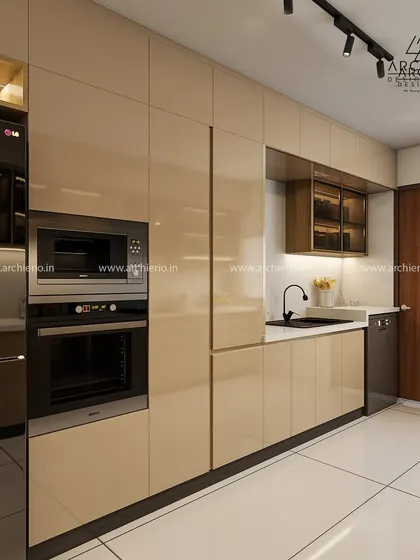 This kitchen showcases seamless integration of appliances, including a dishwasher and built-in ovens, within glossy beige cabinetry.