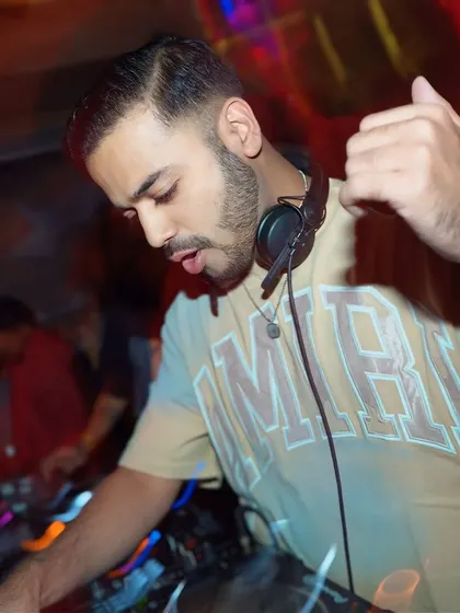 A motion-blurred shot capturing the fast-paced energy of a live set.