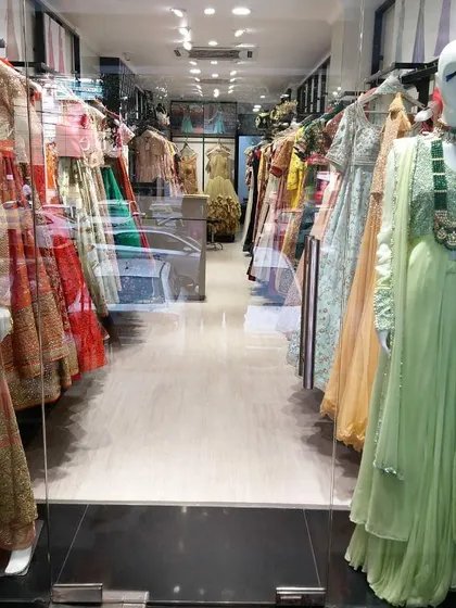 Welcome to our designer outlet in Lajpat Nagar. This view from our storefront gives you a glimpse of the endless racks of authentic designer wear waiting to be discovered, all at incredible discount prices.