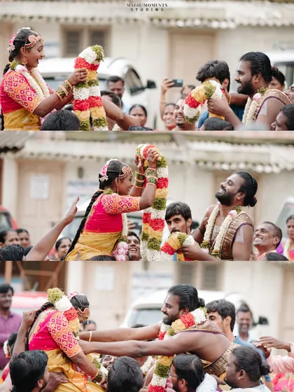 The fun and games of a wedding ceremony, where the bride and groom are lifted up by their families for the garland exchange.