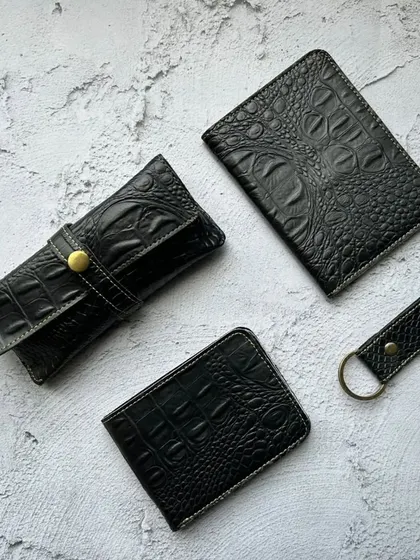 The croc-textured 4-in-1 combo in classic black. This set includes a wallet, eyewear case, passport cover, and keychain, offering a sleek and coordinated look without any personalization.