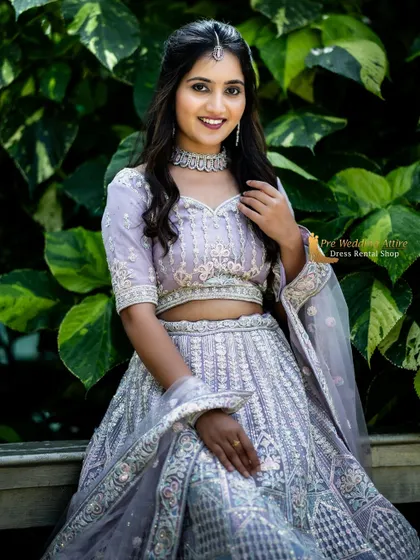 A bright, smiling portrait in the lavender lehenga, perfect for capturing happy pre-wedding moments.