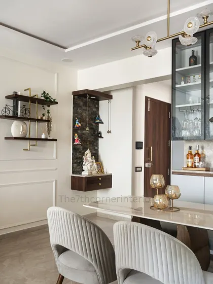 At the entrance of the home, I designed these floating bookshelves with fabricated rods coated in elegant gold PVD, creating a sophisticated and welcoming first impression.