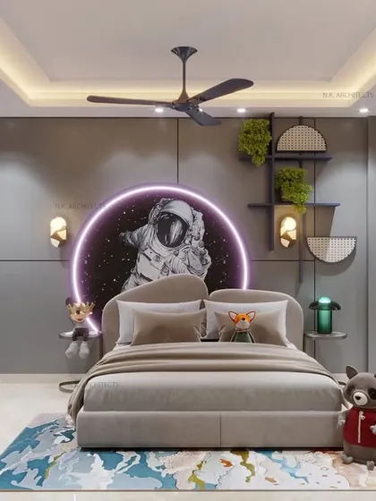 A kids' room designed for a future astronaut. This space-themed room features a custom astronaut mural with neon lighting, a chalkboard on the wardrobe, and plenty of shelving for toys and books.