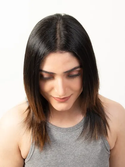A top-down view of the model's hair with the topper applied, proving its seamless integration and natural appearance.