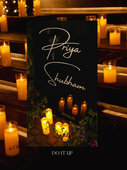 A simple and elegant welcome sign for the sangeet, surrounded by the warm glow of numerous candles. This set a sophisticated and intimate tone right from the entrance.