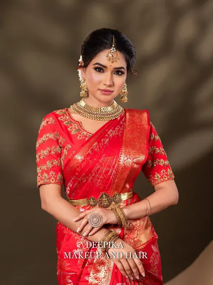 A poised and elegant portrait of the bride. The focus is on her confident expression and the perfectly coordinated jewelry and makeup.