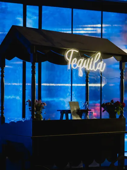 A chic tequila bar with a custom neon sign, adding a fun and modern touch to the evening's festivities.
