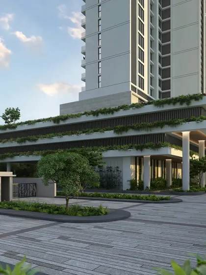 The entrance to our twin-tower luxury project in Nashik. The grand, landscaped driveway and green-covered podium create a welcoming environment that sets the tone for the 75,000 sq. ft. of shared amenity spaces within.