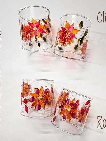 These floral lamp chimneys are painted in warm 'Olive' and 'Rose' color palettes, perfect for creating a cozy, autumnal atmosphere.