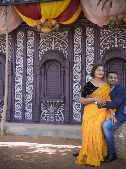 The intricate details of this traditional Chettinad-style doorway provide a rich and cultural backdrop for this couple's portrait.