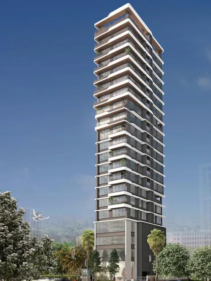 This residential tower in Matunga showcases a fluid and contemporary design. The wrap-around balconies with their curved edges give the building a soft, organic feel, distinguishing it from typical high rise structures.