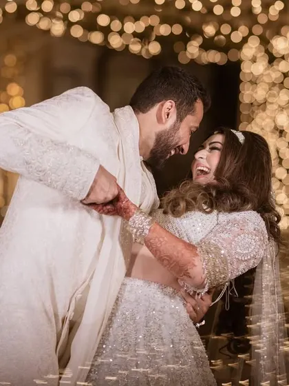 A moment of pure, uninhibited laughter. These are the candid shots that truly show a couple's personality and their joy.