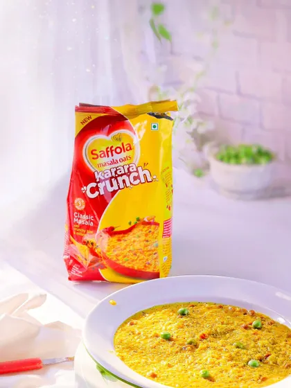 A commercial shot for Saffola Masala Oats, presented in a bright and airy style. The clean lighting and simple presentation make the product look healthy, quick, and delicious.