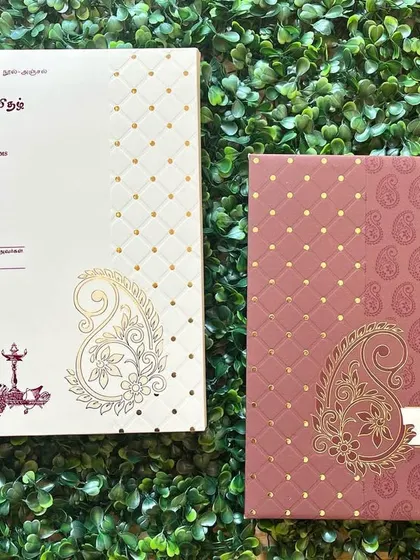 Another view of our Tamil wedding invitation, showing the elegant script and traditional lamp motif.