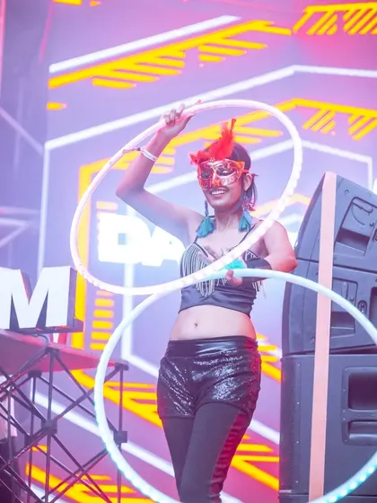 Getting into character with a mask and LED hoops. Themed events are a great opportunity to play with costumes and create a unique persona for the night.