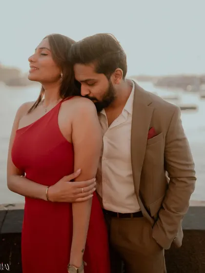 A tender and romantic close-up shot during the golden hour by the sea.