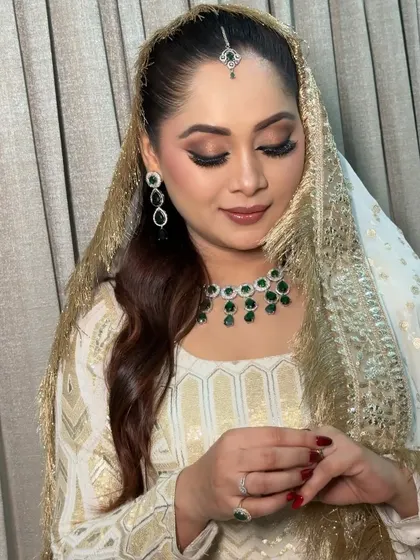 The complete Nikkah look with the dupatta perfectly draped. I ensure every detail, from makeup to draping, is taken care of so the bride can enjoy her day.