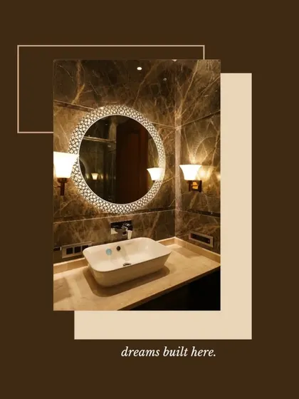 Dreams are built here. This bathroom showcases a beautiful vessel sink on a marble countertop, a decorative backlit mirror, and warm wall sconces, creating a luxurious and inviting atmosphere.