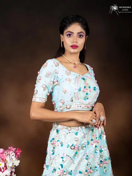A close-up of the makeup for the light blue lehenga. The pink tones in the makeup beautifully complement the pastel outfit.