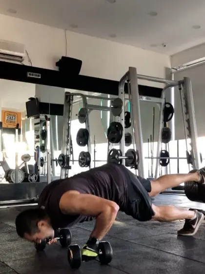 This is an advanced push-up variation using dumbbells to increase the range of motion and challenge stability. We're always finding new ways to push the limits and keep the body guessing.
