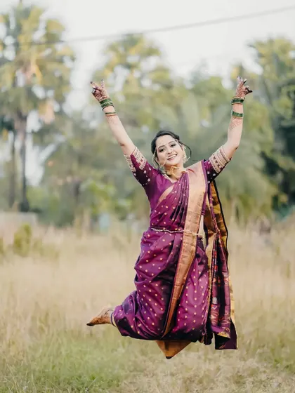A joyful jump from the bride, perfectly capturing the celebratory mood of the wedding day.