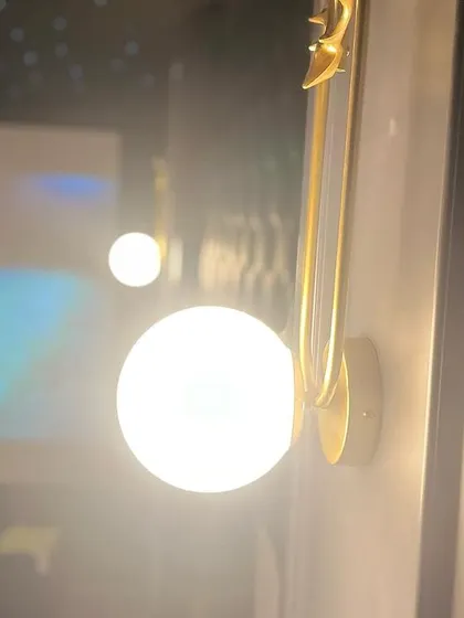 A detailed close-up of the wall sconce, showing the quality of the fixtures I use to complement the overall design of the theater.