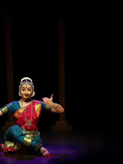 A seated pose from the Kanasu Dance Event, showing the versatility of the stage space and lighting.