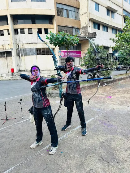 Archery and Holi celebrations. Two of our students take a fun shot together, covered in colors, showcasing the fun and festive side of our academy.