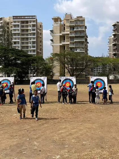 Young archers walking back from the targets during the Drona Cup. These events are a great social experience for the kids.