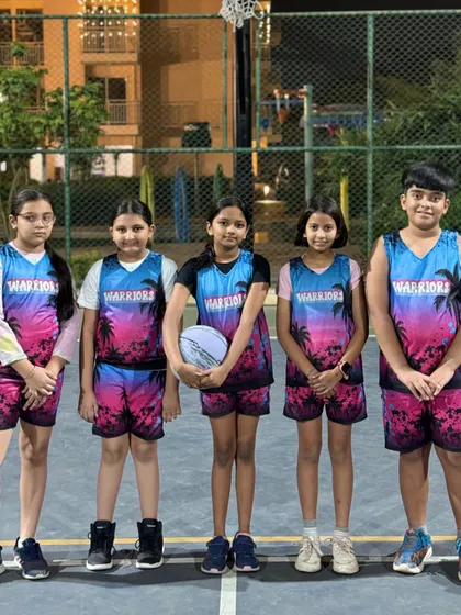 Our girls' team showing off their vibrant custom Warriors jerseys before a game.