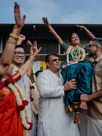 A playful moment during a Tamil wedding ritual. The joy and laughter shared between the couple are what make these candid shots so special and memorable.