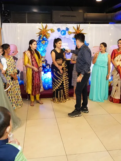Getting the ladies on stage for a fun game at a birthday celebration.