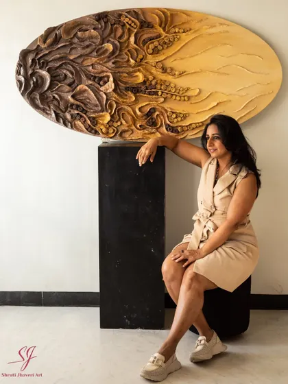 This piece is 'The Enchanted Abyss,' a 60-inch oval sculpture made from upcycled paper and mixed media. It's a piece that shaped me as much as I shaped it.