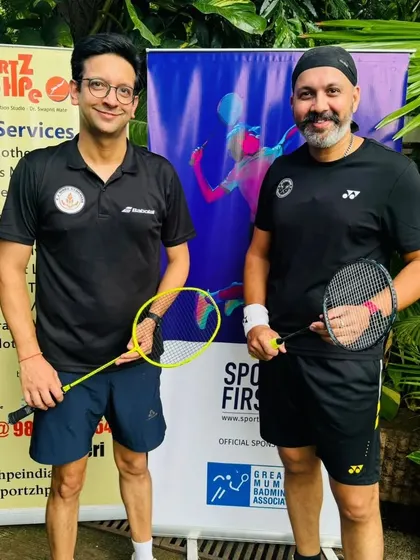 With my partner before our match. Preparation and partnership are key to success in doubles badminton.