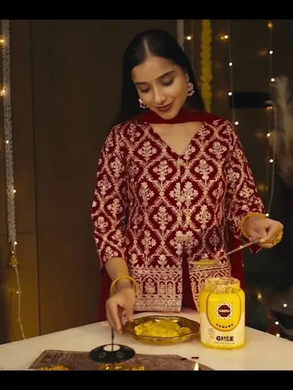Another still from the Vastu Ghee ad. This shot shows the main actress with a soft, glowing makeup look that appears natural and beautiful on camera.