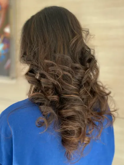 Our faculty demonstrates how to create soft, defined curls on medium-length hair. This versatile style can be dressed up or down for any occasion.
