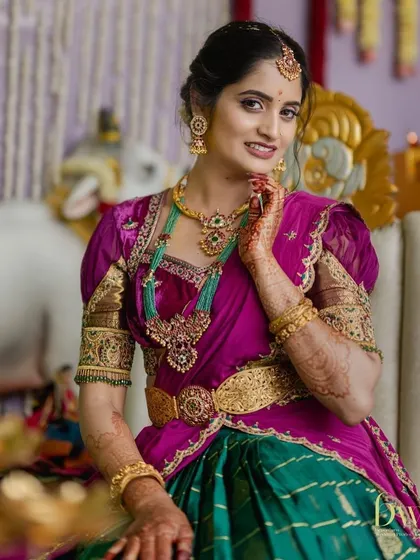 A beautiful seated portrait from the same event. The makeup is flawless and radiant, designed to look perfect in professional photographs.