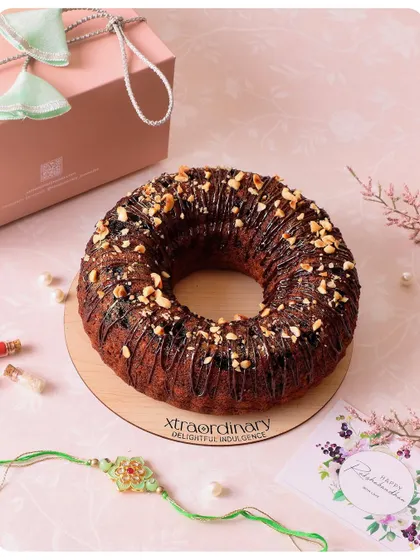 Our Nutella Banana Bundt Cake is a popular choice for Rakhi. It's drizzled with chocolate, topped with nuts, and comes ready for gifting.