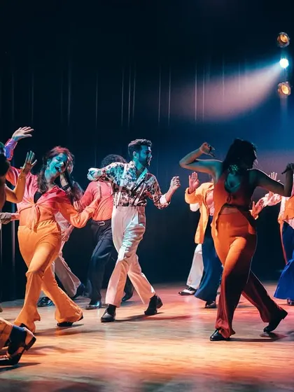 The whole crew getting down on stage, capturing the funky, collective vibe of our Soul Train tribute.