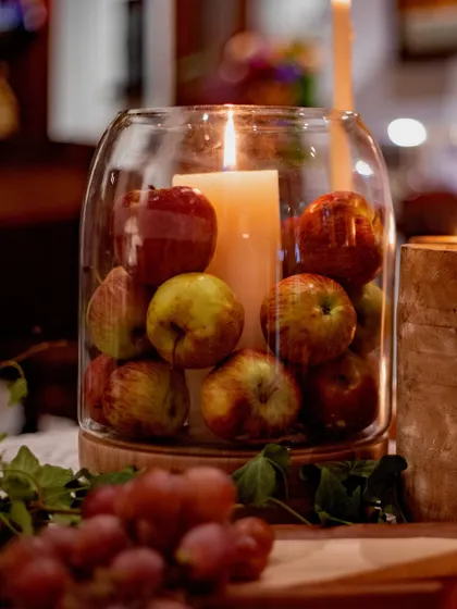 Another angle of the apple and candle arrangement, showing how simple, natural elements can be elevated into a beautiful and unique decor piece.