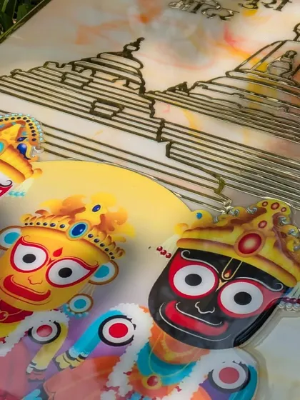 A detailed shot of the Shri Jagannath Puri temple frame. The UV-printed image of the deities is vibrant and sharp, and the golden acrylic temple cutout adds a beautiful 3D element.