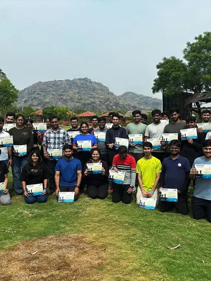 The team proudly displays their completion certificates. This final ritual reinforces the sense of accomplishment and concludes the event on a high note.