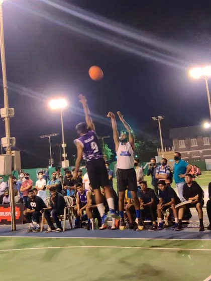 A jump shot during a night game at the DG Cup.