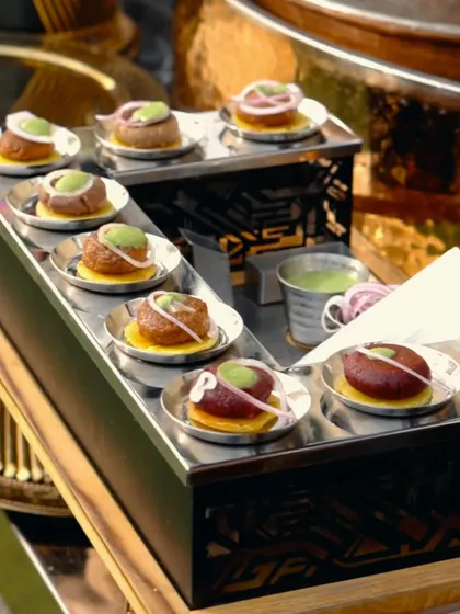Each Galouti Kebab is a small piece of art. Here you can see them being individually plated and garnished, ready to be served to your guests.