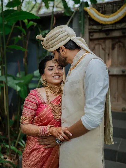 A gentle moment of affection against a backdrop of lush greenery. We love creating these serene and intimate couple portraits that you will cherish for a lifetime.