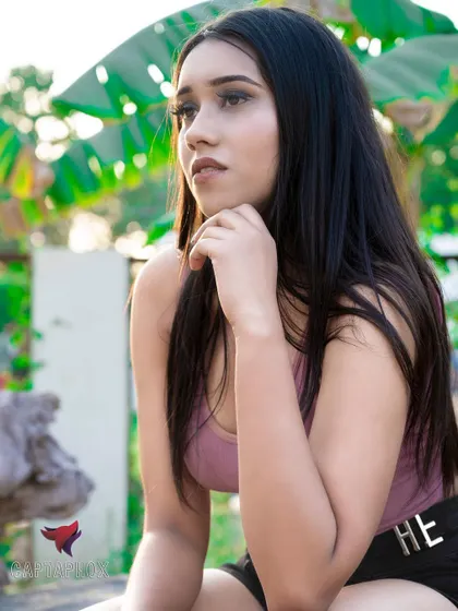 A pensive outdoor portrait captured in soft, natural light. This type of shot is excellent for showing a model's range of expression in a relaxed, on-location setting.