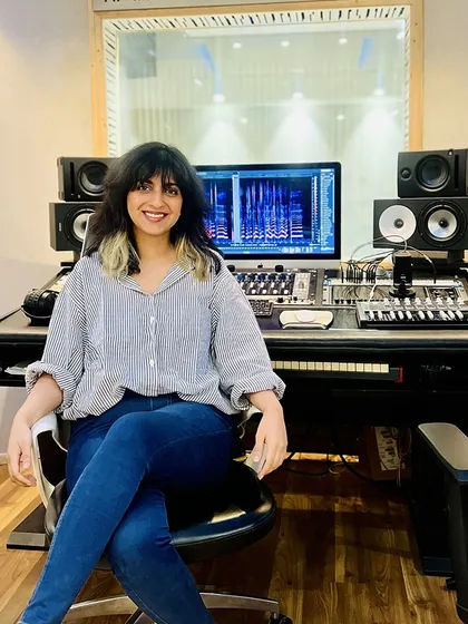Artist Sukhnidh Kaur at the control desk. Our studio is equipped for everything from tracking vocals to mixing and mastering.