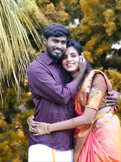 A warm and affectionate embrace captured during a pre-wedding shoot in a beautiful outdoor location.