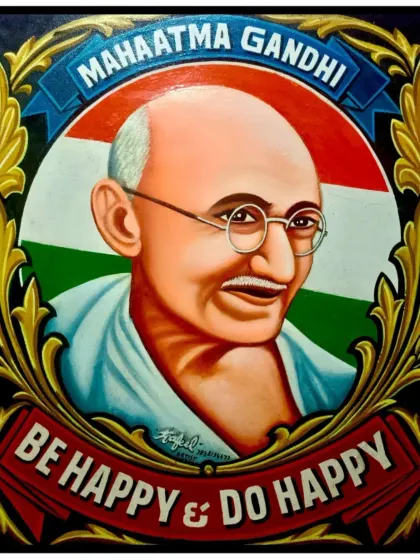 A hand-painted portrait of Mahatma Gandhi, framed with decorative borders and his message, "Be Happy & Do Happy". I create portraits of iconic figures that carry a powerful and positive feeling.
